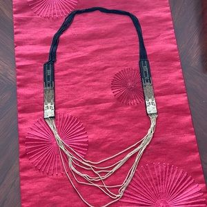 Beautiful black and gold necklace. Great for a night out.